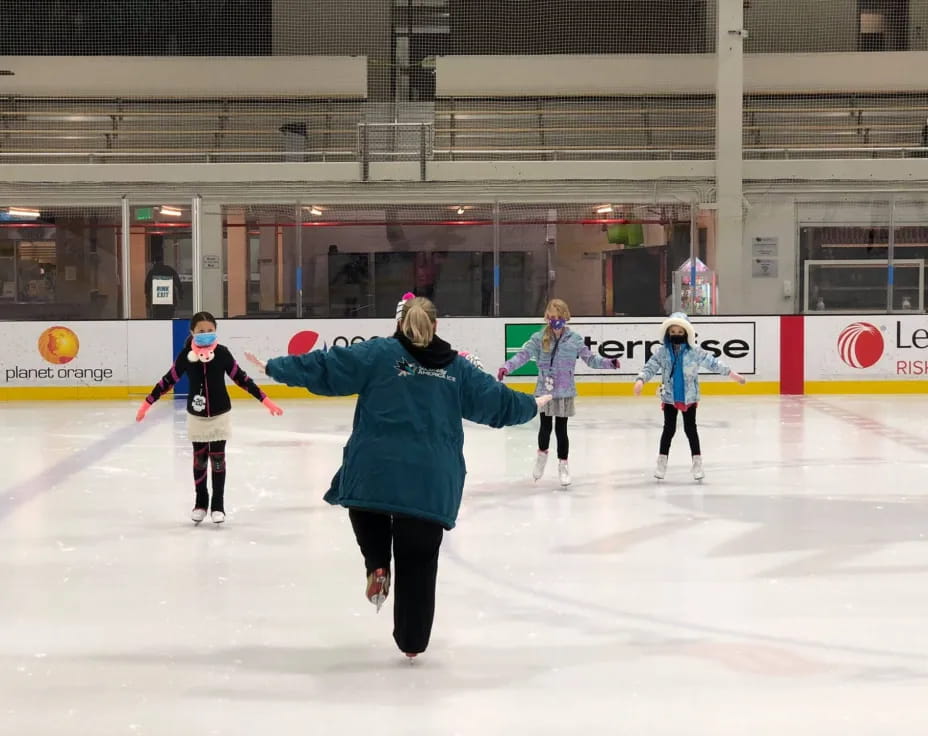 a group of people ice skating