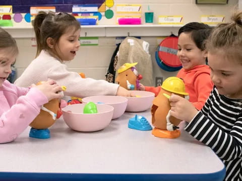 a group of children playing with toys