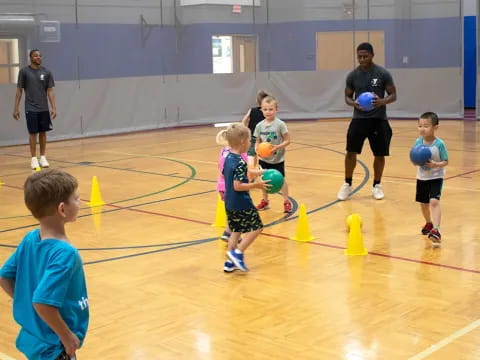 a group of kids playing volleyball