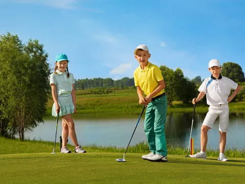 a group of people playing golf