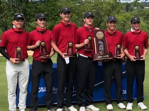 a group of men in red uniforms