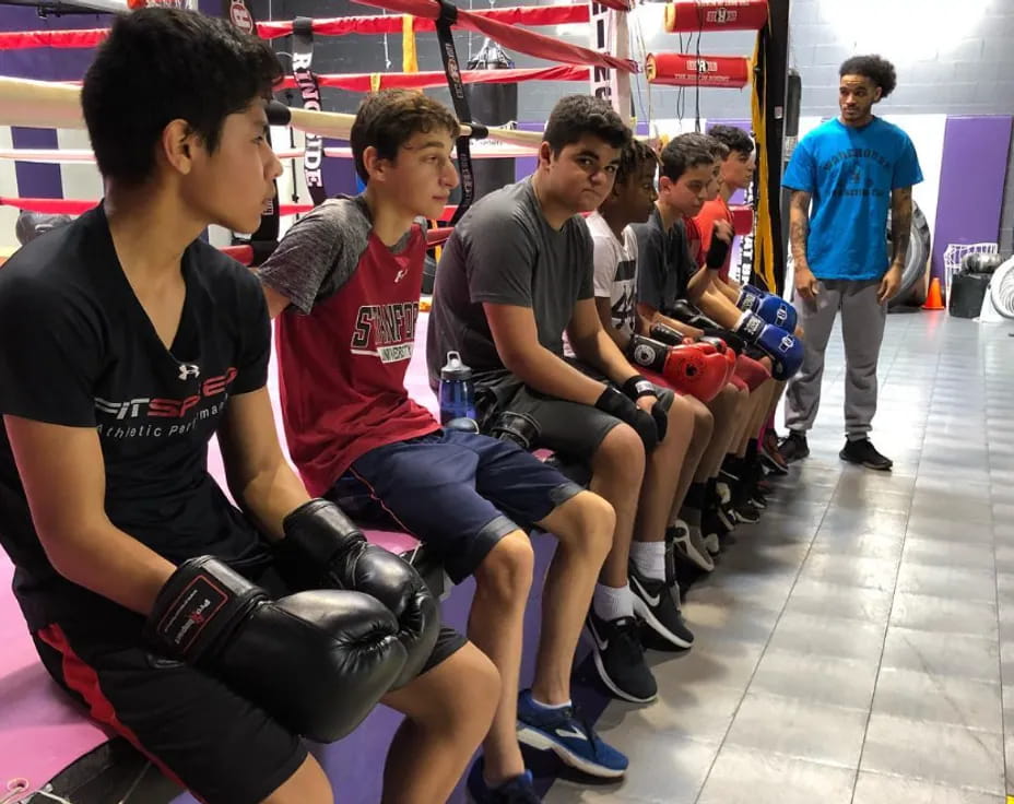 a group of men sitting on a bench