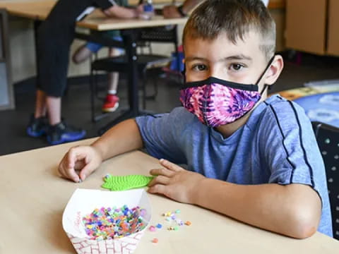 a boy sitting at a table