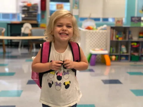 a girl holding a phone