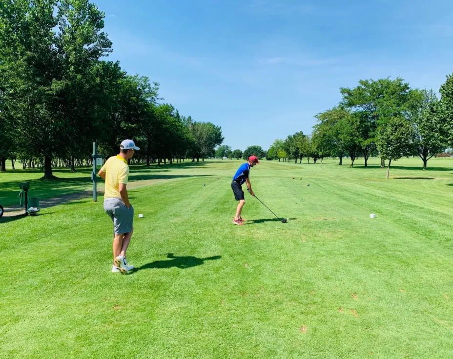 a couple of men playing golf