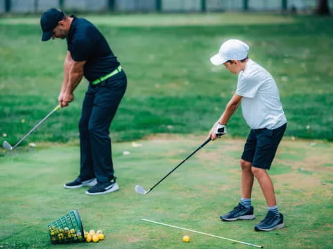 a couple of men playing golf