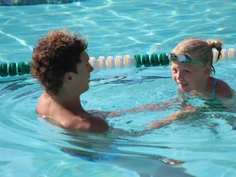 a man and a woman in a pool