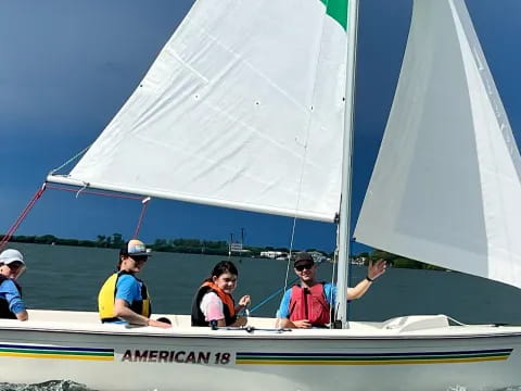 a group of people on a sailboat
