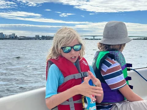 a woman and a child on a boat