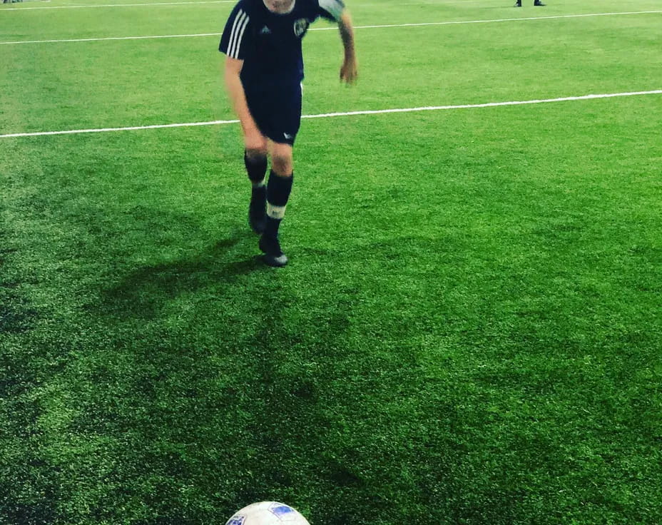 a football player kicking a ball