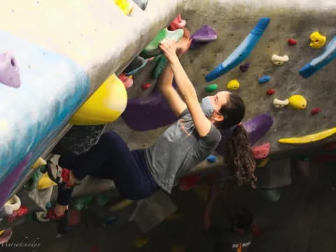 a person climbing a rock wall