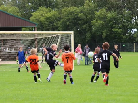 a group of kids playing football
