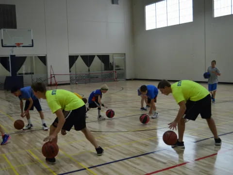 a group of people playing basketball