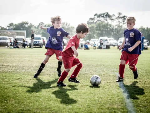 kids playing football on a field