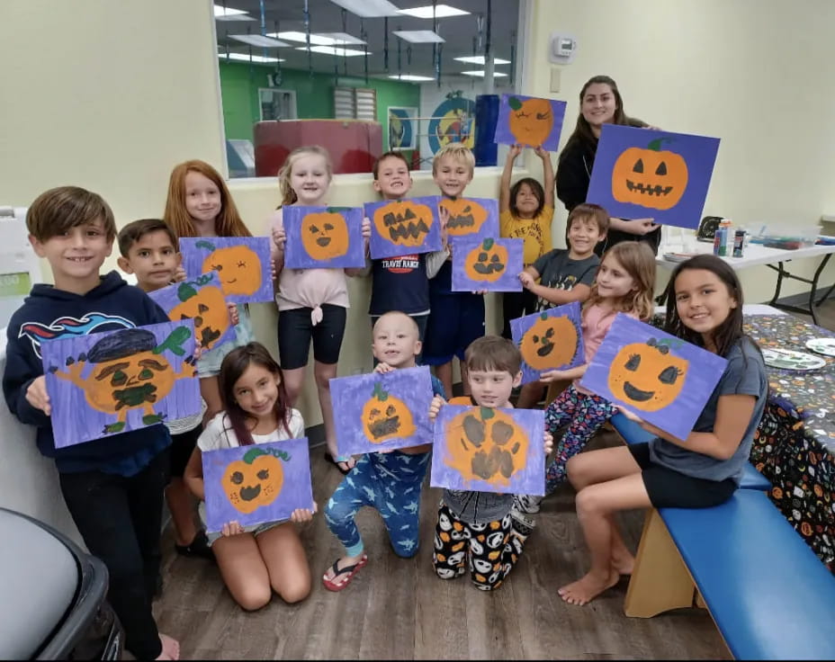 a group of children holding books