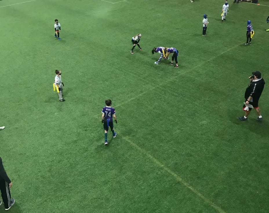 a group of people playing football