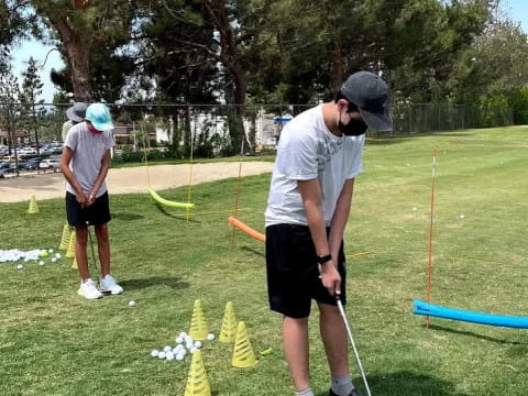 a group of people playing golf