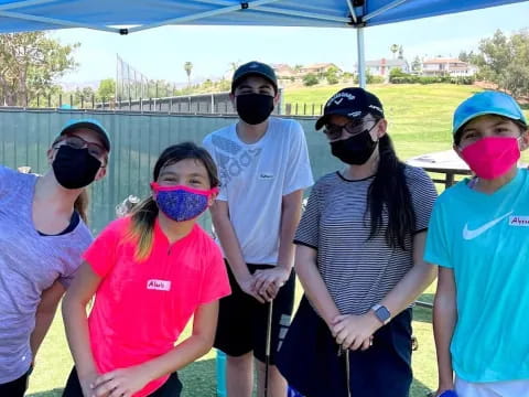 a group of people wearing masks
