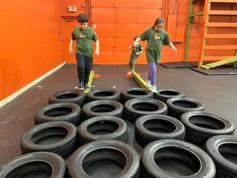 kids with skateboards in a room