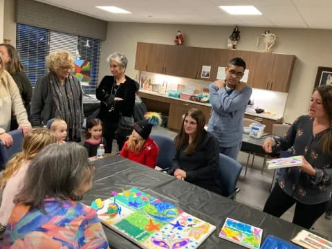 a group of people around a table