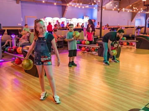 a group of people playing bowling