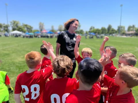 a man addressing a group of kids