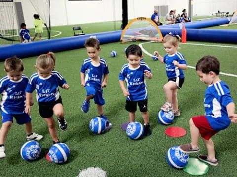 a group of kids playing football