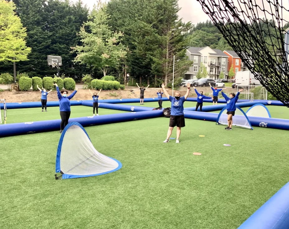 a group of people playing basketball