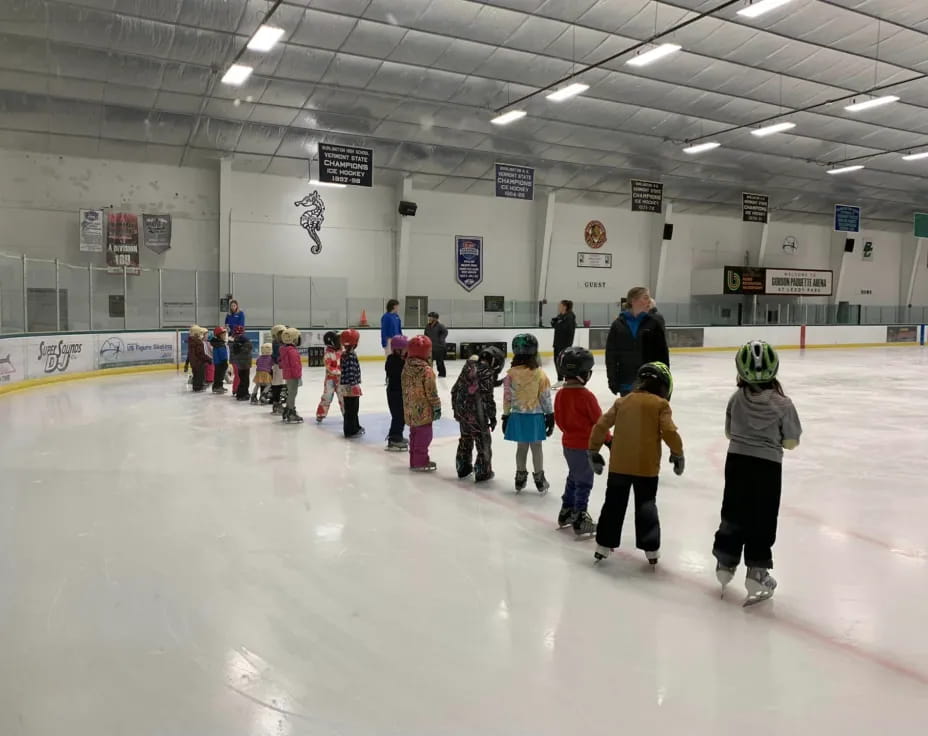 a group of people on an ice rink
