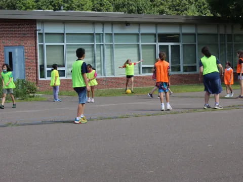 a group of kids playing football