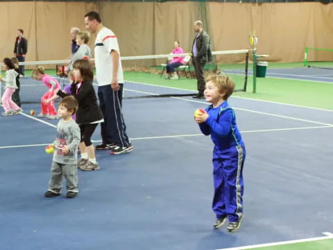 a kid holding a ball