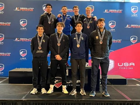 a group of men posing for a photo