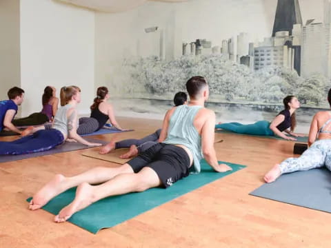 a group of people sitting on mats