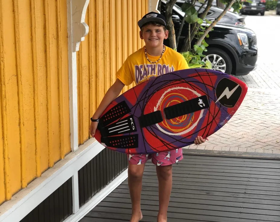 a person holding a surfboard