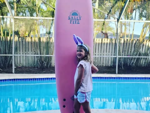 a person holding a surfboard