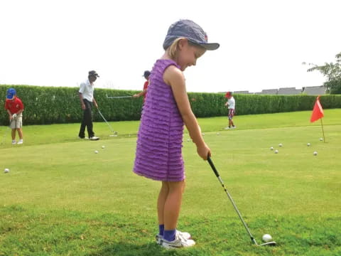 a girl playing golf