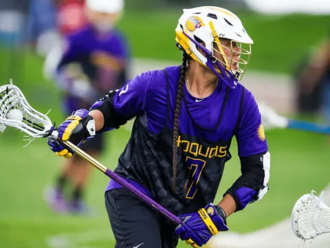 a person playing lacrosse