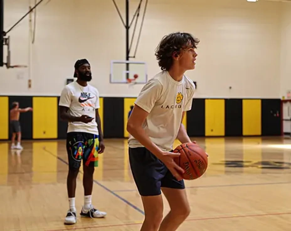 a person holding a basketball