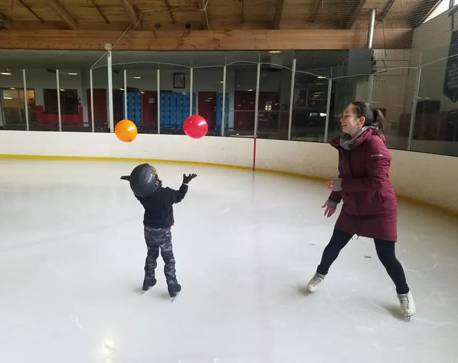 a person and a child ice skating
