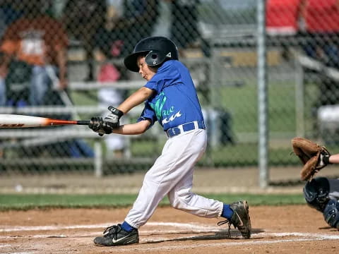 a young boy playing baseball