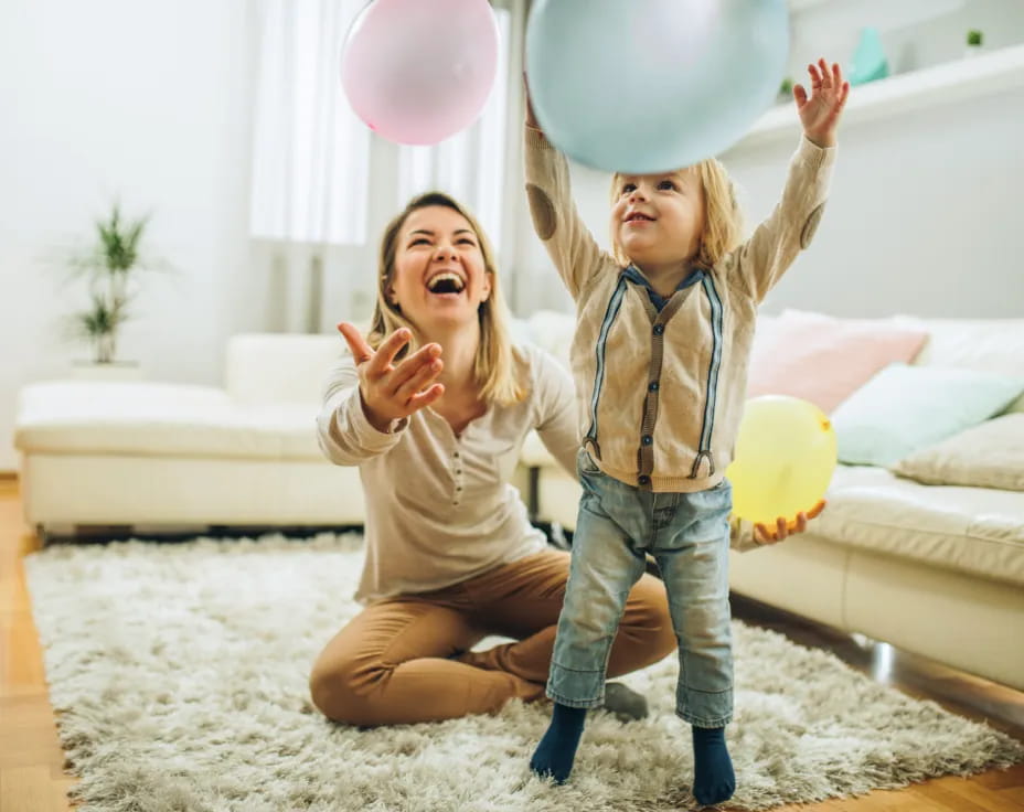 a couple of girls holding balloons