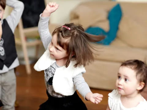 a girl with her arms up