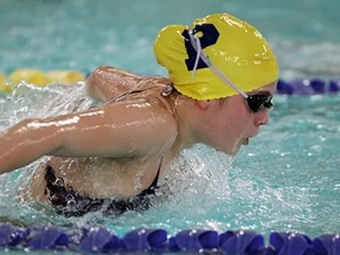 a person swimming in a pool