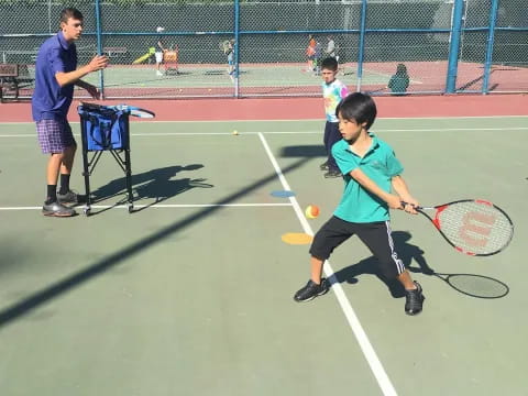 a boy playing tennis
