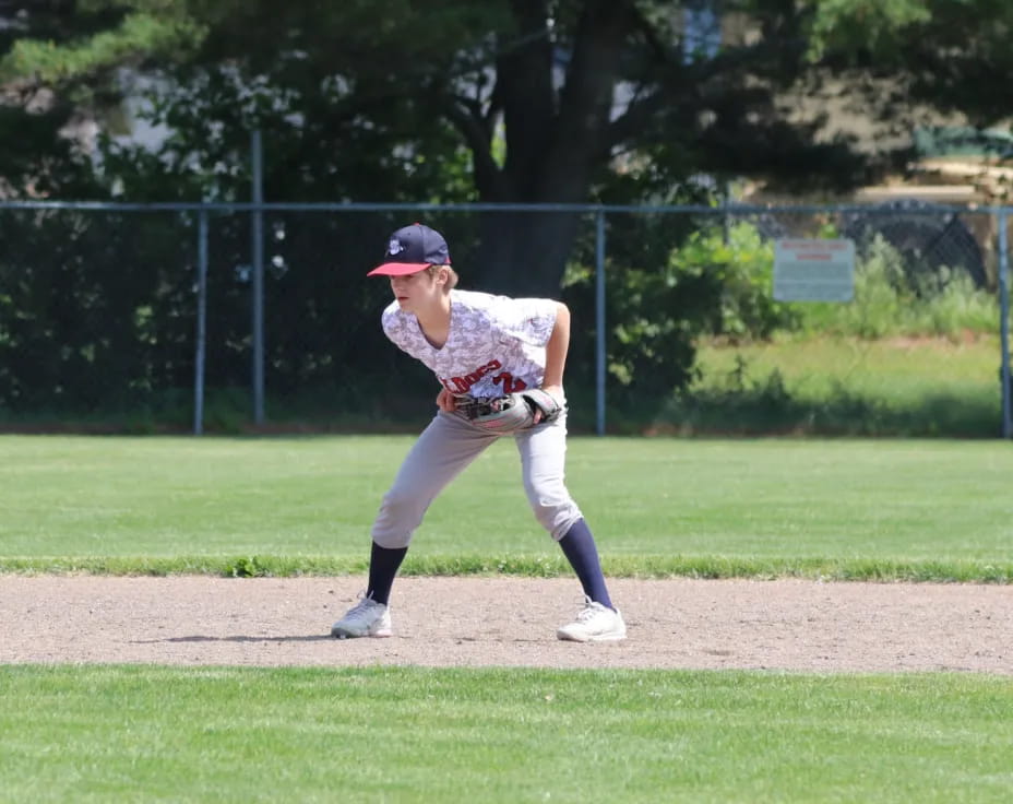 a baseball player pitching a ball