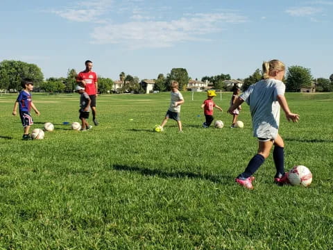 a group of kids playing football