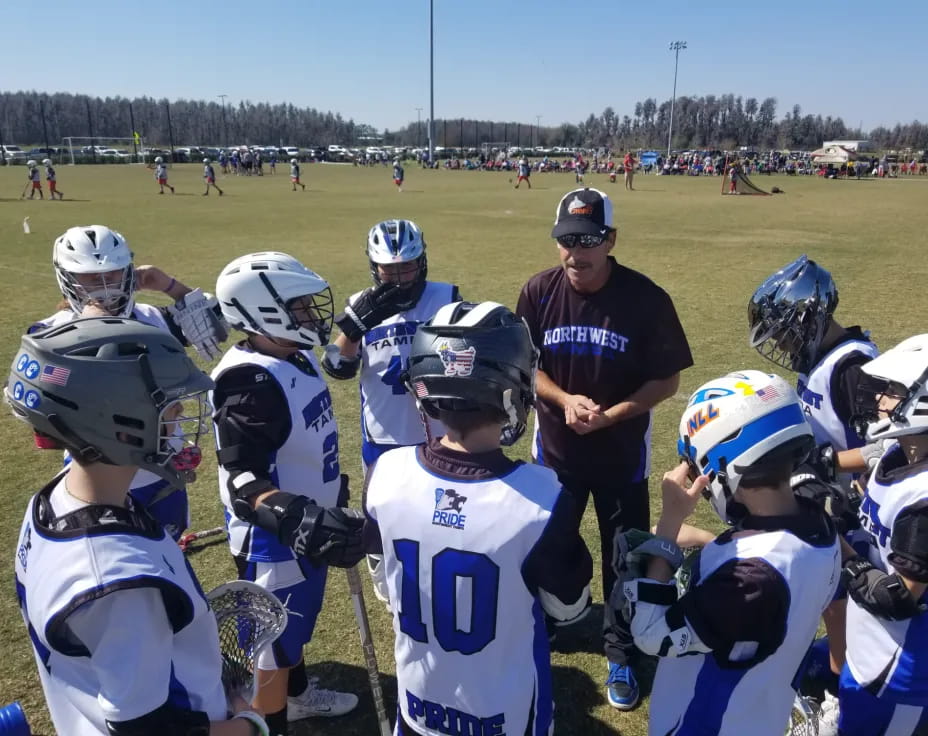 a football coach talking to his team