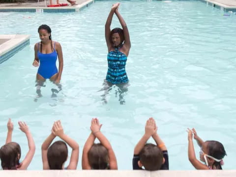 a group of women in a pool