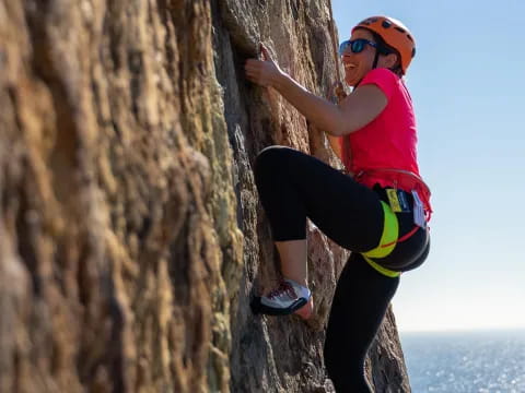 a person climbing a rock