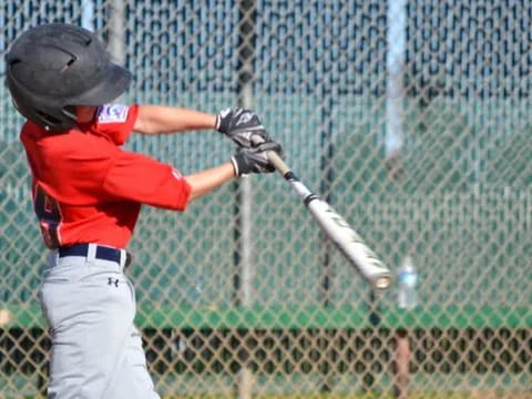 a young boy playing baseball